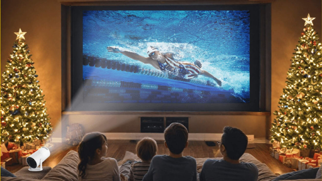 Family watching Christmas movie with Vision Beam projector in cozy living room