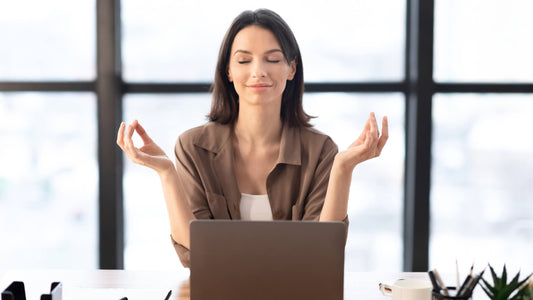Woman meditating with ViSound Drift invisible earbuds for better focus and calm